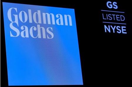 The ticker symbol and logo for Goldman Sachs is displayed on a screen on the floor at the New York Stock Exchange (NYSE) in New York, U.S., December 18, 2018. REUTERS/Brendan McDermid/File Photo