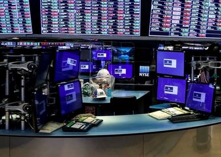 Dividers are seen inside a trading post on the trading floor as preparations are made for the return to trading at the New York Stock Exchange (NYSE) in New York, U.S., May 22, 2020. REUTERS/Brendan McDermid