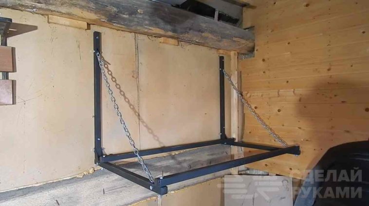 Раскладная полка для хранения автомобильных покрышек