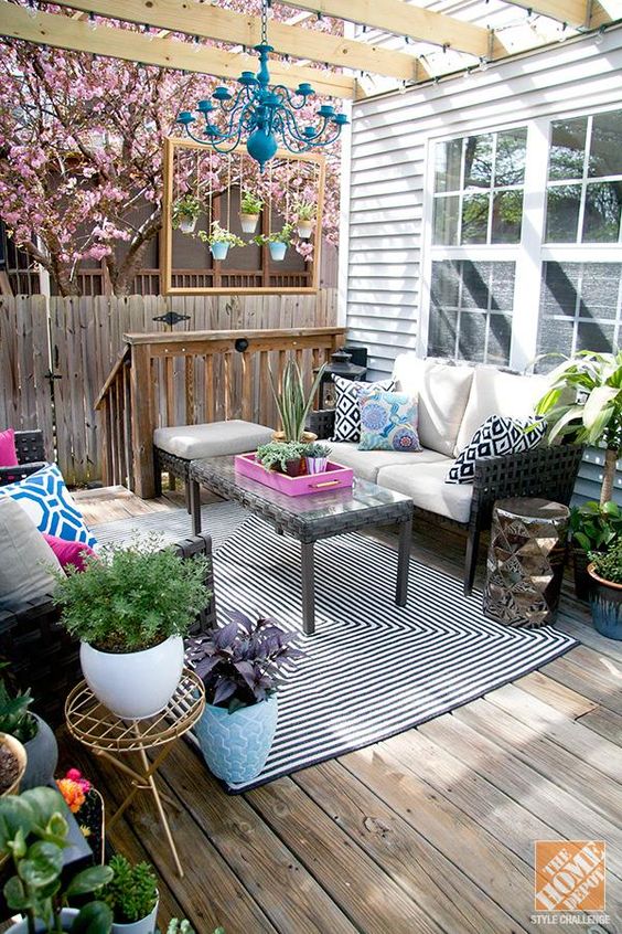  07 colorful outdoor living room on the porch with patterns prints and potted greenery