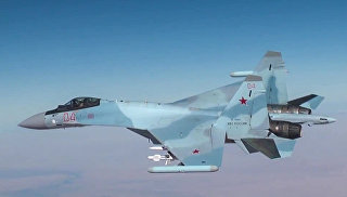Самолет Су-30 ВКС РФ во время нанесения авиаудара по объектам террористов в Сирии. Архивное фото