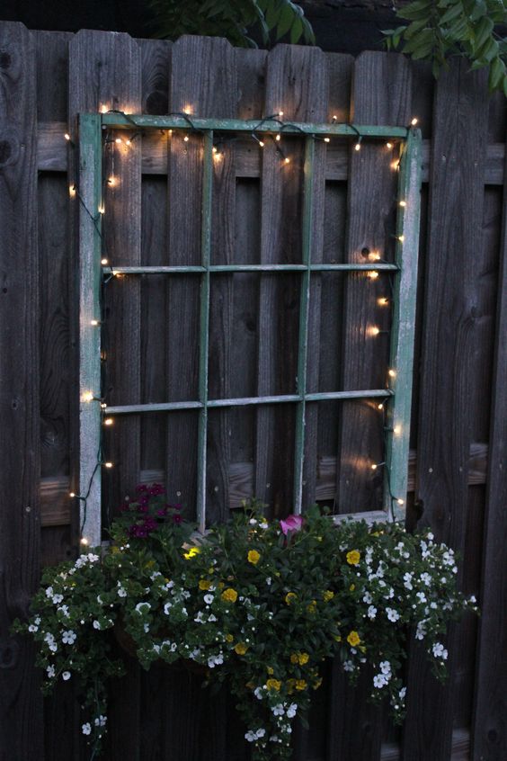  28 illuminate your old window planter with beautiful flowers with LED lights