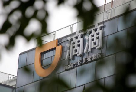 FILE PHOTO: Logo of Didi Chuxing is seen at its headquarters building in Beijing, China August 28, 2018. REUTERS/Jason Lee/File Photo