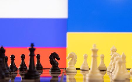 FILE PHOTO: Chess pieces are seen in front of displayed Russia and Ukraine's flags in this illustration taken January 25, 2022. REUTERS/Dado Ruvic/Illustration/File Photo