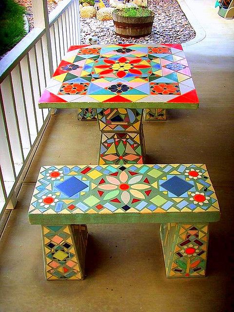  22 a colorful mosaic table and benches with a retro feel and bold patterns