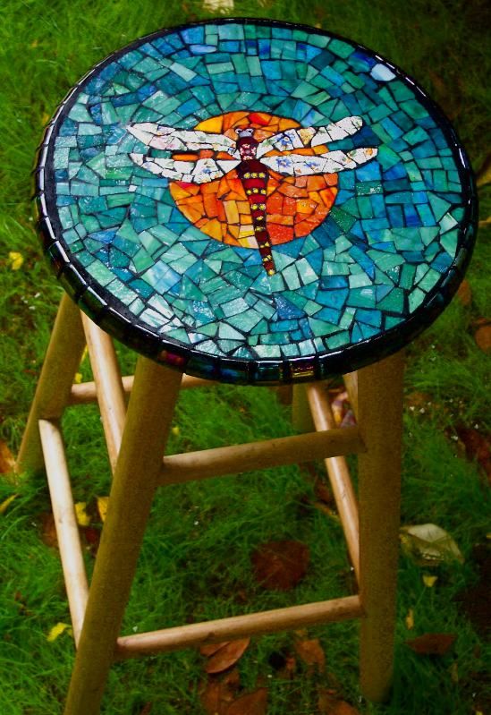  21 a wooden stool with a colorful dragonfly mosaic on top for a cool look
