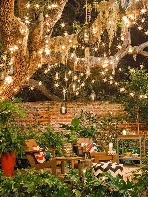  27 lots of string lights turn this backyard into a magical space