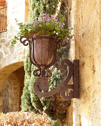 $350 Madrigal Wall Planter at Neiman Marcus. 18"W x 22.25"D x 24"T.: 