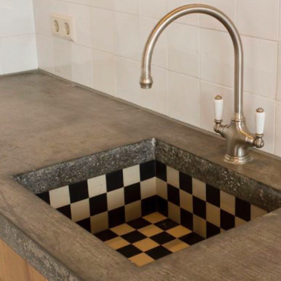 A checkered kitchen sink and granite countertop for bohemian decor ideas