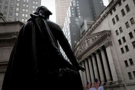 A statue of George Washington stands as Federal Hall across Wall Street from the New York Stock Exchange in Manhattan in New York City, New York, U.S., October 26, 2020. REUTERS/Mike Segar/File Photo