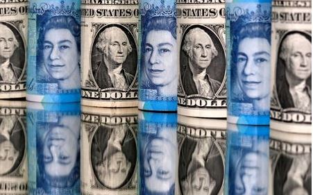 Pound and U.S. dollar bills are seen in this illustration taken January 6, 2020. REUTERS/Dado Ruvic/Illustration