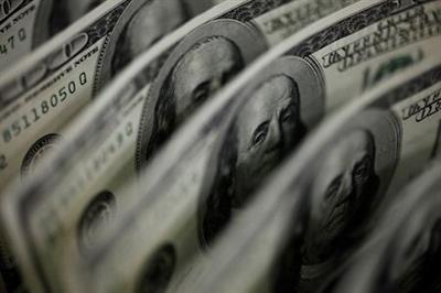 FILE PHOTO: A picture illustration shows U.S. 100 dollar bank notes taken in Tokyo August 2, 2011. REUTERS/Yuriko Nakao/File Photo