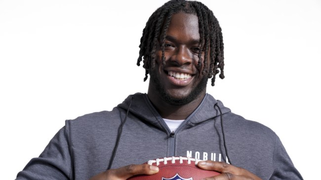 Olu Fashanu poses for a photo at the NFL Combine.