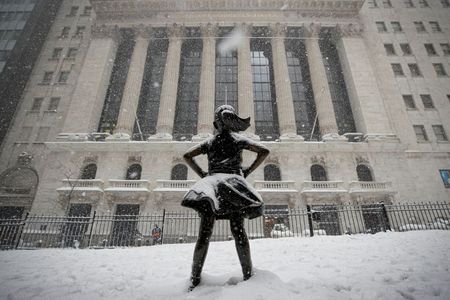 The "Fearless Girl" sculpture is seen outside the New York Stock Exchange (NYSE) during a snow storm in the Manhattan borough of New York City, New York, U.S., February 1, 2021. REUTERS/Brendan McDermid