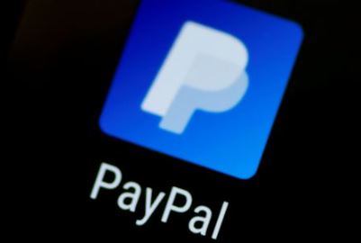 FILE PHOTO: The PayPal app logo seen on a mobile phone in this illustration photo October 16, 2017. REUTERS/Thomas White/Illustration//File Photo