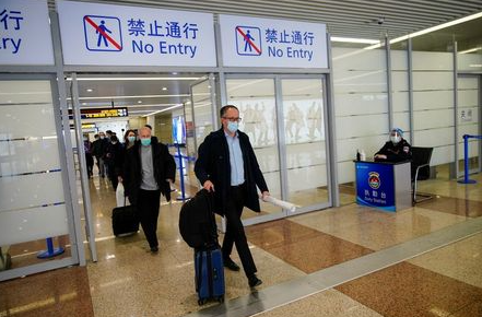 Peter Ben Embarek, and other members of the World Health Organisation (WHO) team tasked with investigating the origins of the coronavirus disease (COVID-19), arrive at the Pudong International Airport in Shanghai, China February 10, 2021. REUTERS/Aly Song