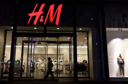 A woman enters a store of the Swedish fashion retailer H&M at a shopping mall in Beijing, China March 24, 2021. REUTERS/Florence Lo