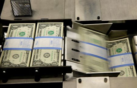 FILE PHOTO: United States one dollar bills are put in packaging bands during production at the Bureau of Engraving and Printing in Washington November 14, 2014. REUTERS/Gary Cameron/File Photo