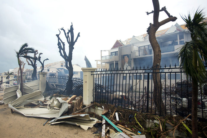 Smoke Rises From A Fire Amid Debris And Damaged Buildings In Marigot, Near The Bay Of Nettle, On The French Island Of Saint Martin On Wednesday