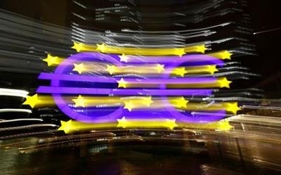 The euro sign in front of the former headquarters of the European Central Bank (ECB) is photographed with long exposure in Frankfurt, Germany, November 20, 2017. REUTERS/Kai Pfaffenbach
