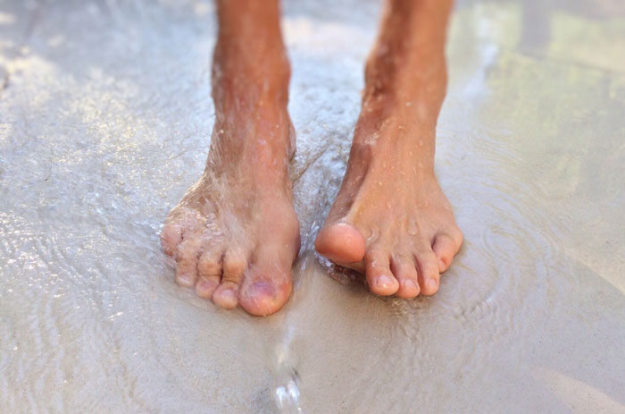 bare-feet-water-beach