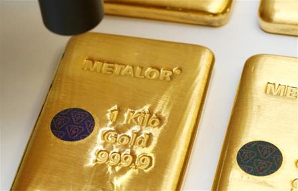 The Sicpa Oasis validator system (bullion protect) is pictured on one kilogram bar of gold at Swiss refiner Metalor in Marin near Neuchatel, Switzerland July 5, 2019. Picture taken July 5, 2019. To match Special Report GOLD-SWISS/FAKES REUTERS/Denis Balibouse 
