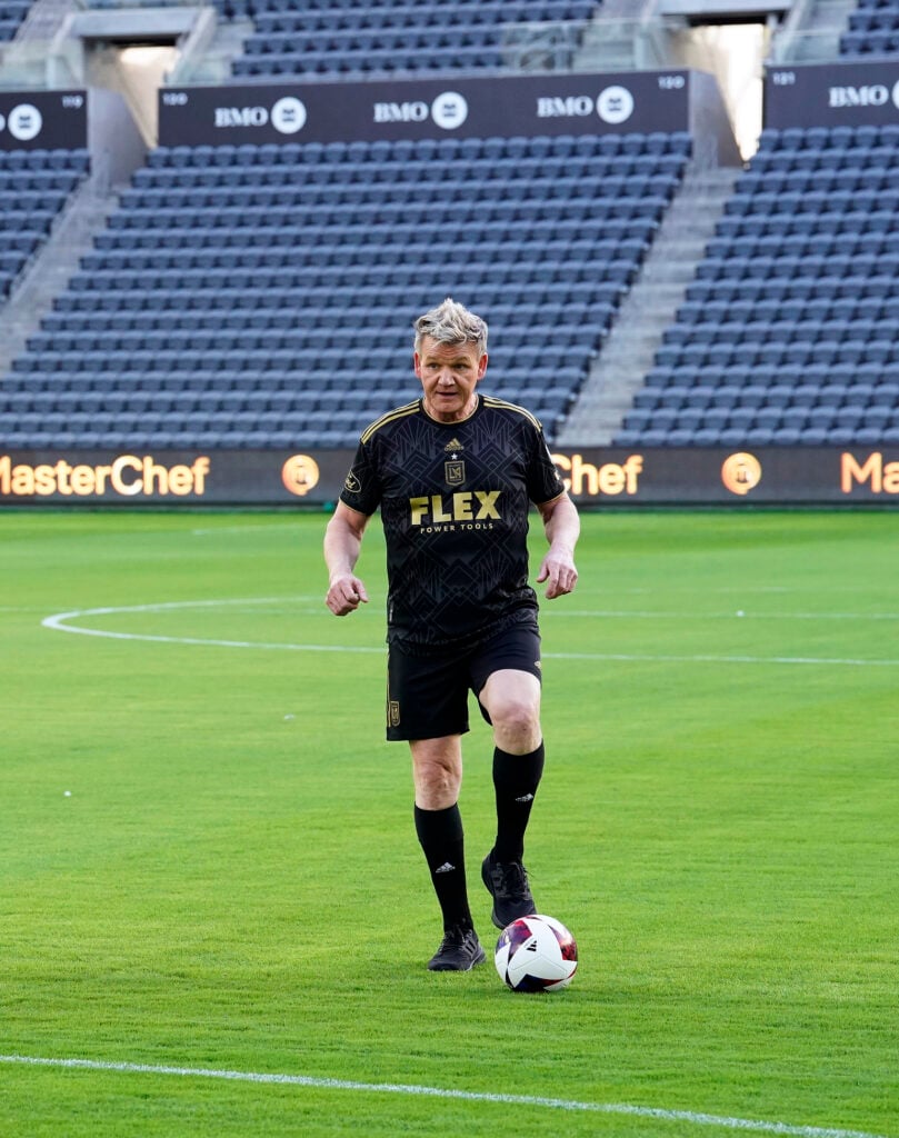 Gordon Ramsay in the âLAFC Fieldâ with soccer ball.