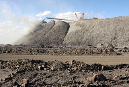 FILE PHOTO: A mining machine is seen at the Bayan Obo mine containing rare earth minerals, in Inner Mongolia, China July 16, 2011. REUTERS/Stringer ATTENTION EDITORS - THIS IMAGE WAS PROVIDED BY A THIRD PARTY. CHINA OUT./File Photo