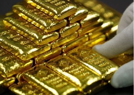 An employee sorts gold bars in the Austrian Gold and Silver Separating Plant's Degussa's in Vienna, Austria, December 15, 2017. REUTERS/Leonhard Foeger