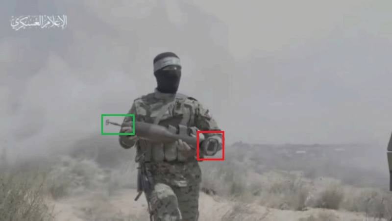 Бежит хамасовец с подарком израильскому танку оружие