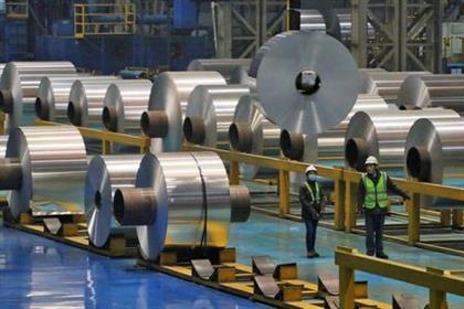 FILE PHOTO: Employees work at the production line of aluminium rolls at a factory in Zouping, Shandong province, China November 23, 2019. REUTERS/Stringer 