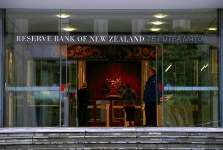 A security guard stands in the main entrance to the Reserve Bank of New Zealand located in central Wellington, New Zealand, July 3, 2017. Picture taken July 3, 2017. REUTERS/David Gray