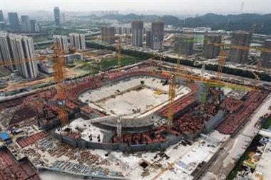 An aerial view shows the construction site of Guangzhou Evergrande Soccer Stadium, a new stadium for Guangzhou FC, developed by China Evergrande Group, in Guangzhou, Guangdong province, China September 26, 2021. Picture taken September 26, 2021 with a drone. REUTERS/Thomas Suen 