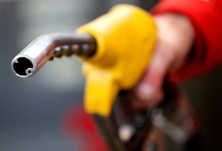 FILE PHOTO: A petrol station attendant prepares to refuel a car in Rome, Italy, January 4, 2012. REUTERS/Max Rossi 