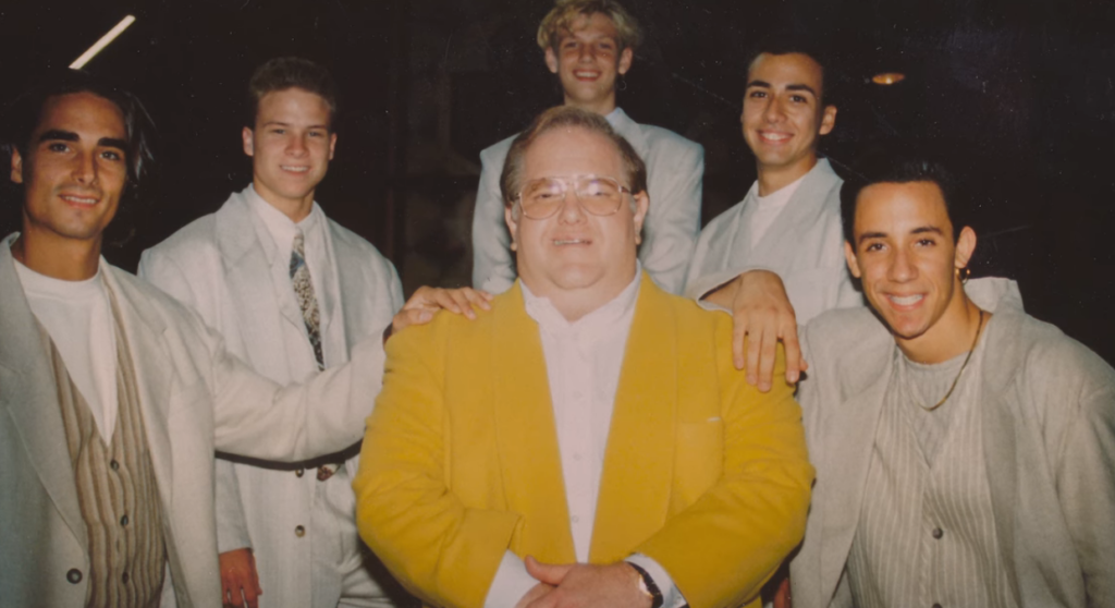 Lou Pearlman poses with his original boy band, The Backstreet Boys.
