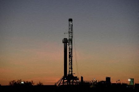 A horizontal drilling rig on a lease owned by Parsley Energy operates at sunrise in the Permian Basin near Midland, Texas U.S. August 24, 2018. Picture taken August 24, 2018. REUTERS/Nick Oxford