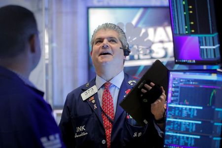 Traders work on the floor of the New York Stock Exchange (NYSE) in New York City, U.S., December 1, 2021. REUTERS/Brendan McDermid