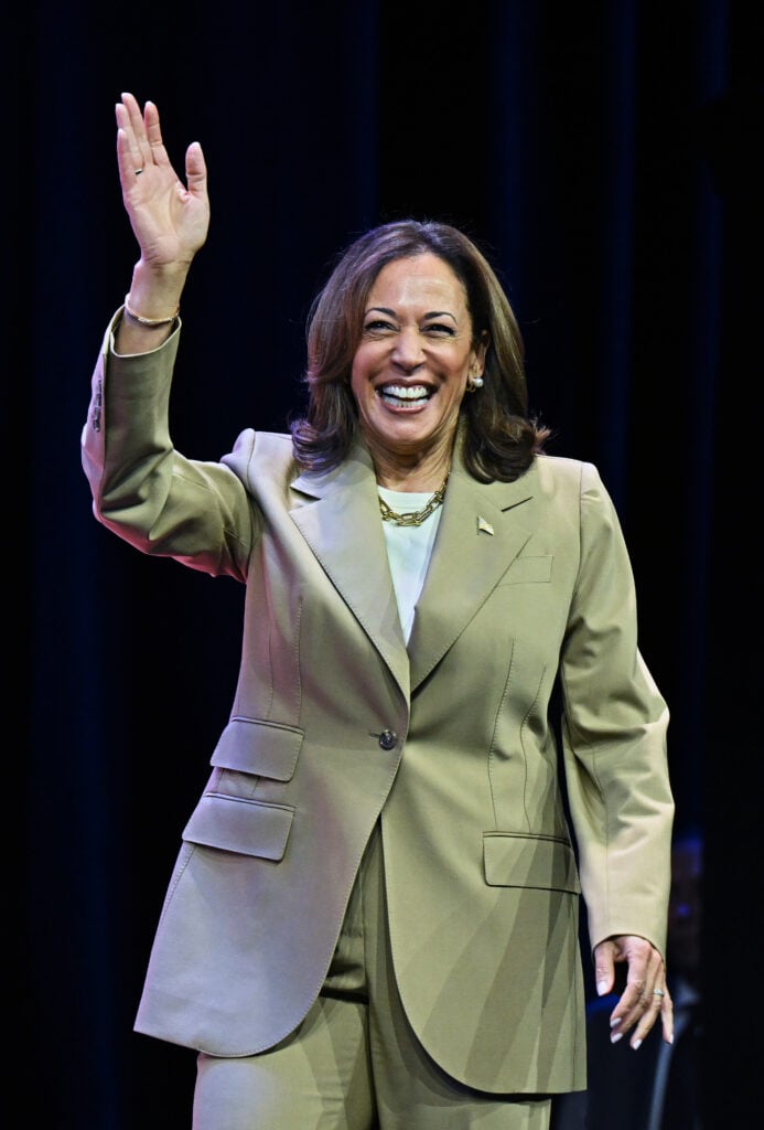 Vice President Kamala Harris waves while walking on stage at a campaign event at the Asian and Pacific Islander American Vote Presidential Town Hall at the Pennsylvania Convention Center on July 13, 2024 in Philadelphia, Pennsylvania.