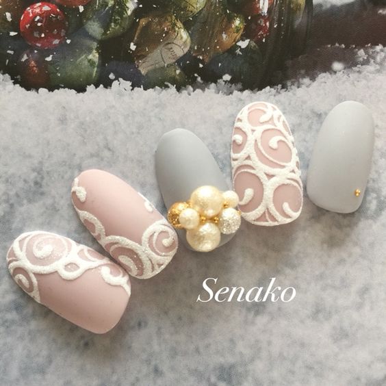 Gray, dusty pink with scroll work and pearl accent nail art