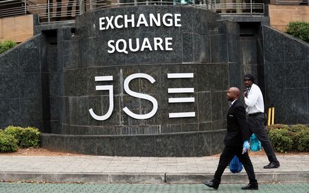 Security officers walk past the Johannesburg Stock Exchange (JSE) in Sandton, South Africa, March 30, 2020. REUTERS/Siphiwe Sibeko