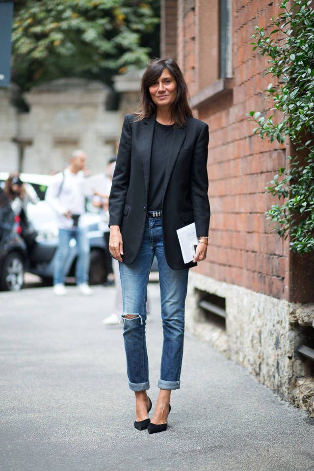 Black jacket. Blue cropped jeans. 