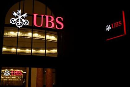 The logo of Swiss bank UBS is seen at a branch office in Basel, Switzerland March 2, 2020. REUTERS/Arnd Wiegmann