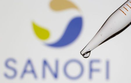 A test tube is seen in front of a displayed Sanofi logo in this illustration taken September 8, 2021. REUTERS/Dado Ruvic/Illustration
