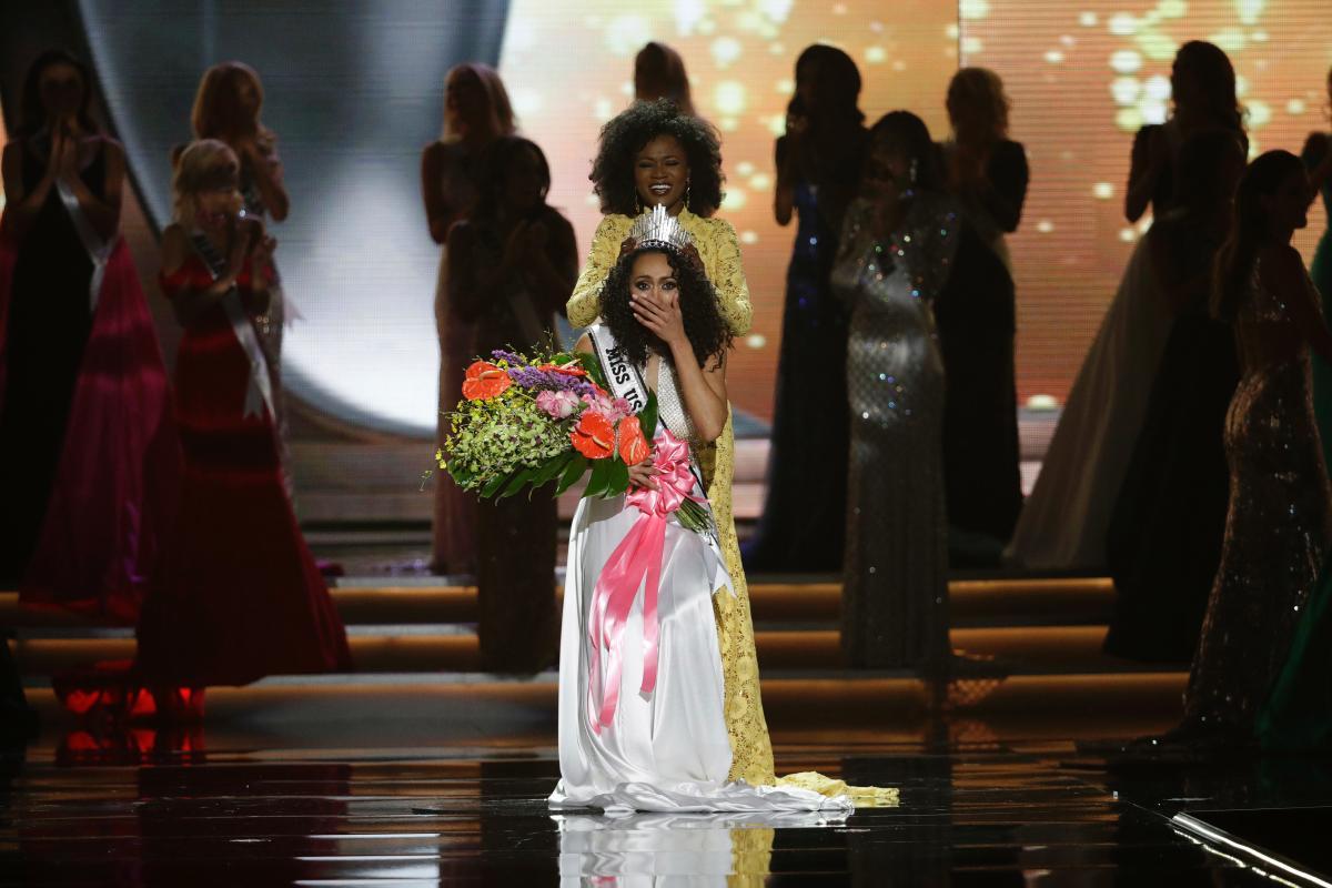 Miss District of Columbia USA Kara McCullough reacts as she is crowned the new Miss USA by former Miss USA Deshauna Barber during the Miss USA contest Sunday, May 14, 2017, in Las Vegas. (AP Photo/John Locher)