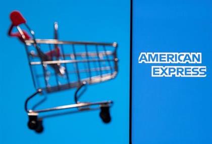 Smartphone with American Express logo is placed near toy shopping cart in this illustration taken, July 15, 2021. REUTERS/Dado Ruvic/Illustration 