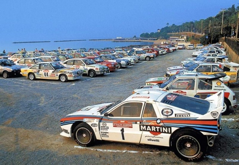 Закрытый парк «Ралли Сан-Ремо» ’85. На переднем плане заводская Lancia Rallye 037 E2, за ней Peugeot 205 T16, 037-я команды Jolly Club и Audi Quattro S1. audi, lancia, quattro, авто, автогонки, автоспорт, гонки, ралли