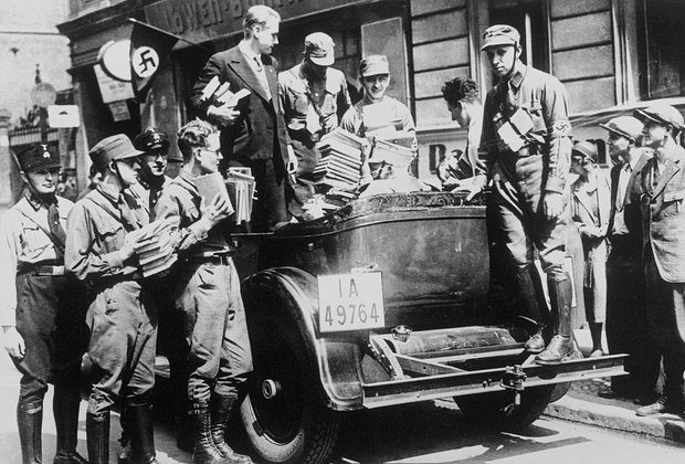 Nazis Taking Books for Burning
(Original Caption) Germany: Books confiscated by this group of young Nazis were taken to huge fire in the Operplatz to be burned in Berlin.