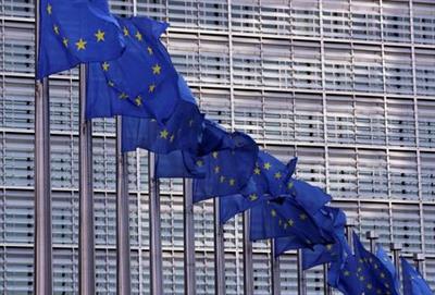 European Union flags fly outside the European Commission headquarters in Brussels, Belgium, February 19, 2020. REUTERS/Yves Herman
