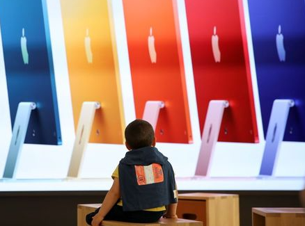 A child looks on at the Apple's new flagship store on the day it opens on Rome's main shopping street, Via del Corso, in Rome, Italy, May 27, 2021. REUTERS/Yara Nardi