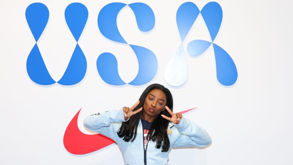 Simone Biles tries on clothes at the Team USA Welcome Experience Ahead of Paris 2024 on July 22, 2024 in Paris, France.